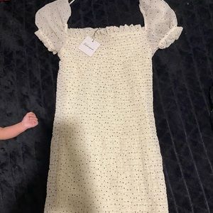 Black and white polka dotted ruched off the shoulder dress